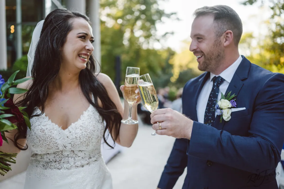A couple toasting after the ceremony